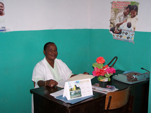 Mona Louis Juste sits in her office in the small clinic she helps run at Redemption Church