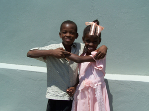 Two young members of the Redemption Church congregation play outside church after Sunday services