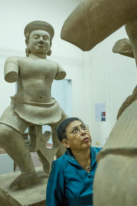 Phoeurng Sackona, the Cambodian minister of culture and fine arts, in the National Museum in Phnom Penh, between two statues that had been returned by American museums and auction houses after it was discovered that they had been looted from Parast Chen temple in Koh Ker. Douglas Latchford was the first “owner” of both statues, according to court documents. Image: Kim Hak