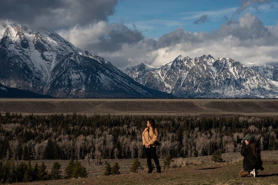 Tourists take in the mountains in Wyoming