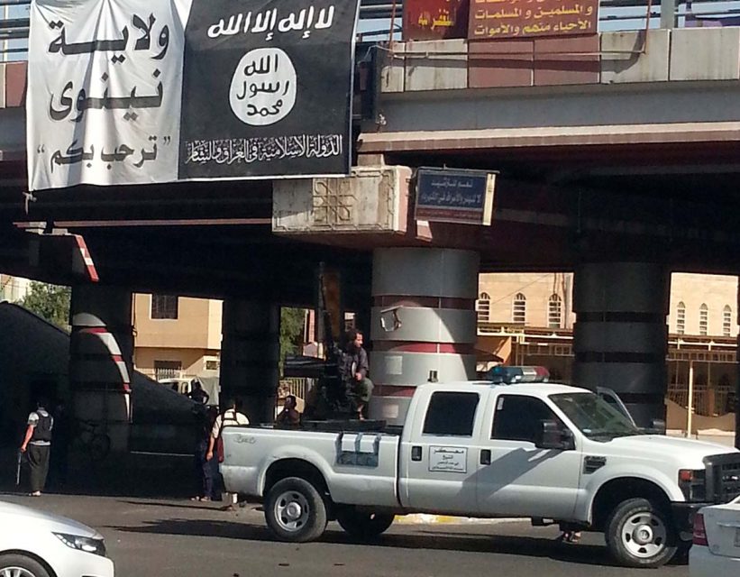 Photo showing an ISIS fighter under a bridge in Mosul in July 2014