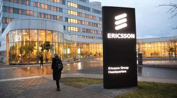Photo of a woman walking near Ericsson's headquarters in Sweden