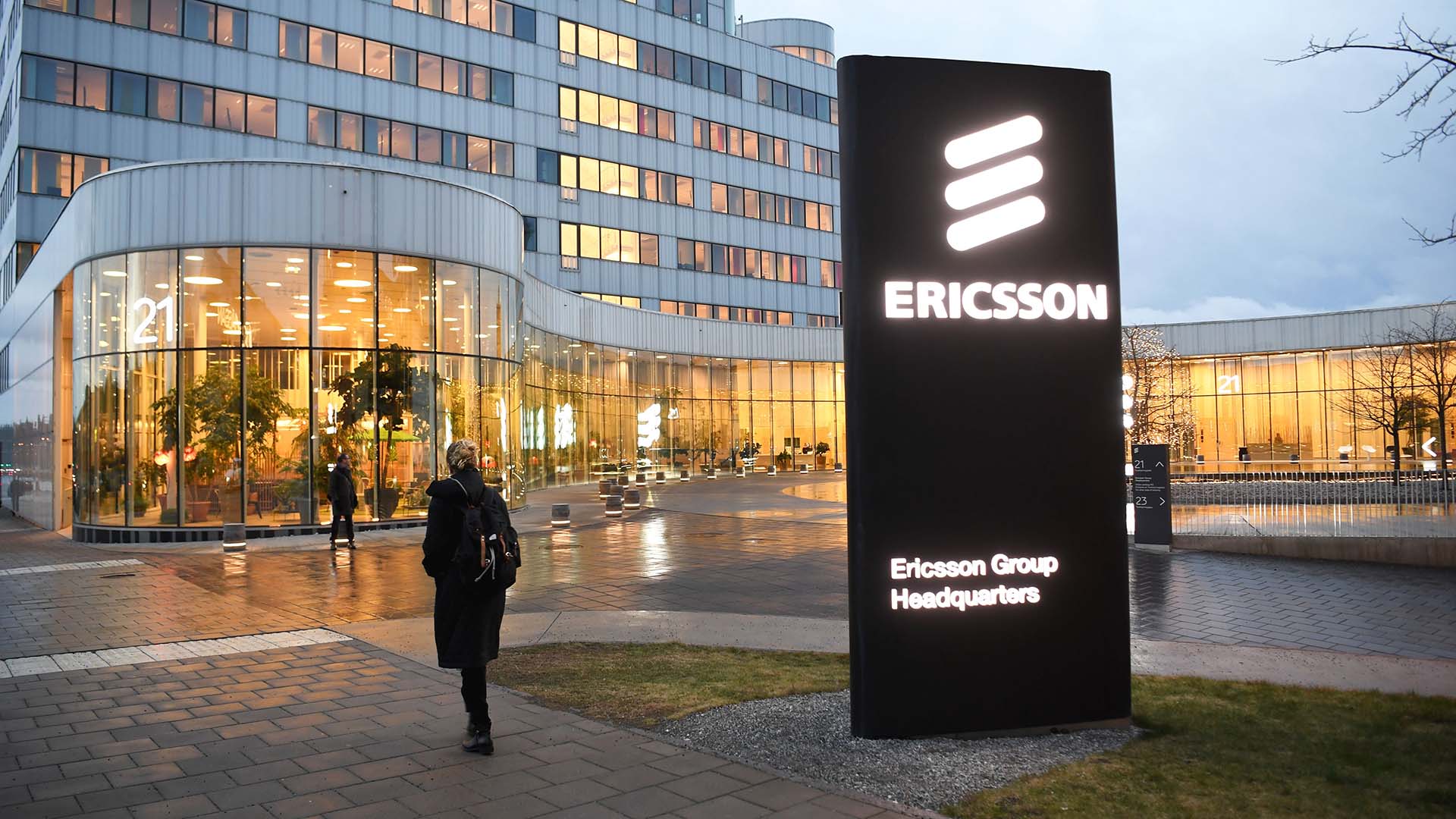 Photo of a woman walking near Ericsson's headquarters in Sweden