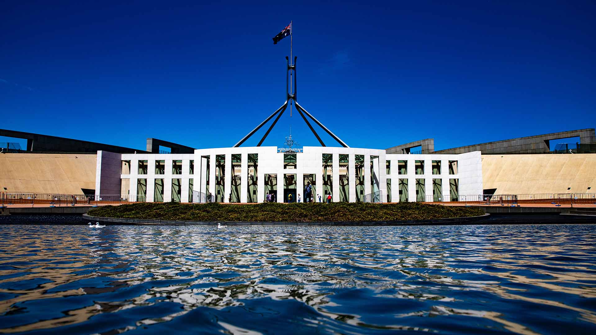 A photo of Parliament House in Canberra on a sunny day