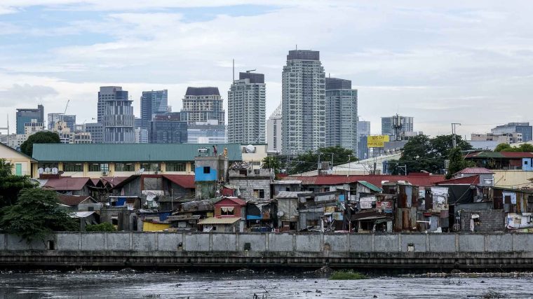 Waterfront home in Manila against the backdrop of the city skyline