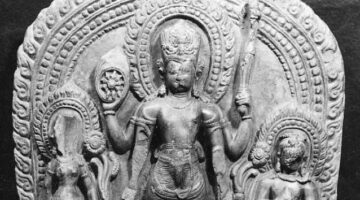 A photos of a stone statue featuring Vishnu