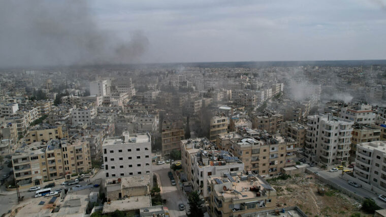 An aerial view of smoke rising over the city of Idlib, Syria 