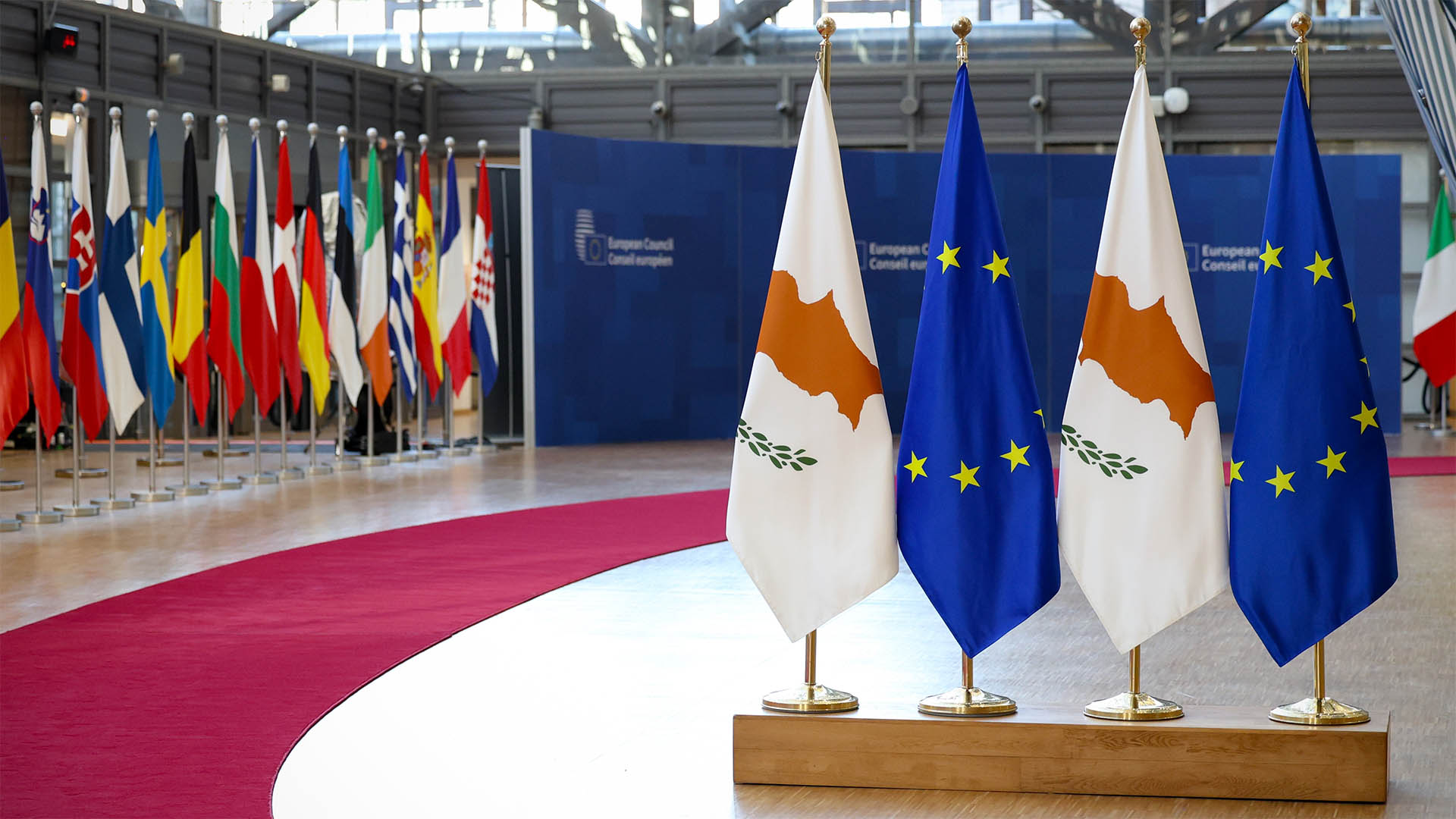 European and Cypriot flags stand in European Council HQ ahead of a meeting in March 2025 in Brussels.