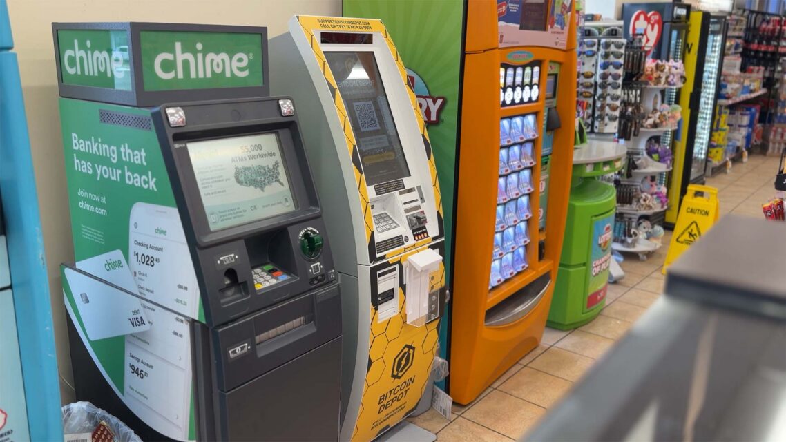 Photo of a yellow Bitcoin Depot ATM between an ordinary ATM and a vending machine in a convenience store.